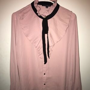 Long sleeved, ruffled blouse